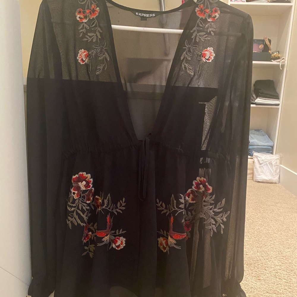Express black sheer top with red and green floral details
